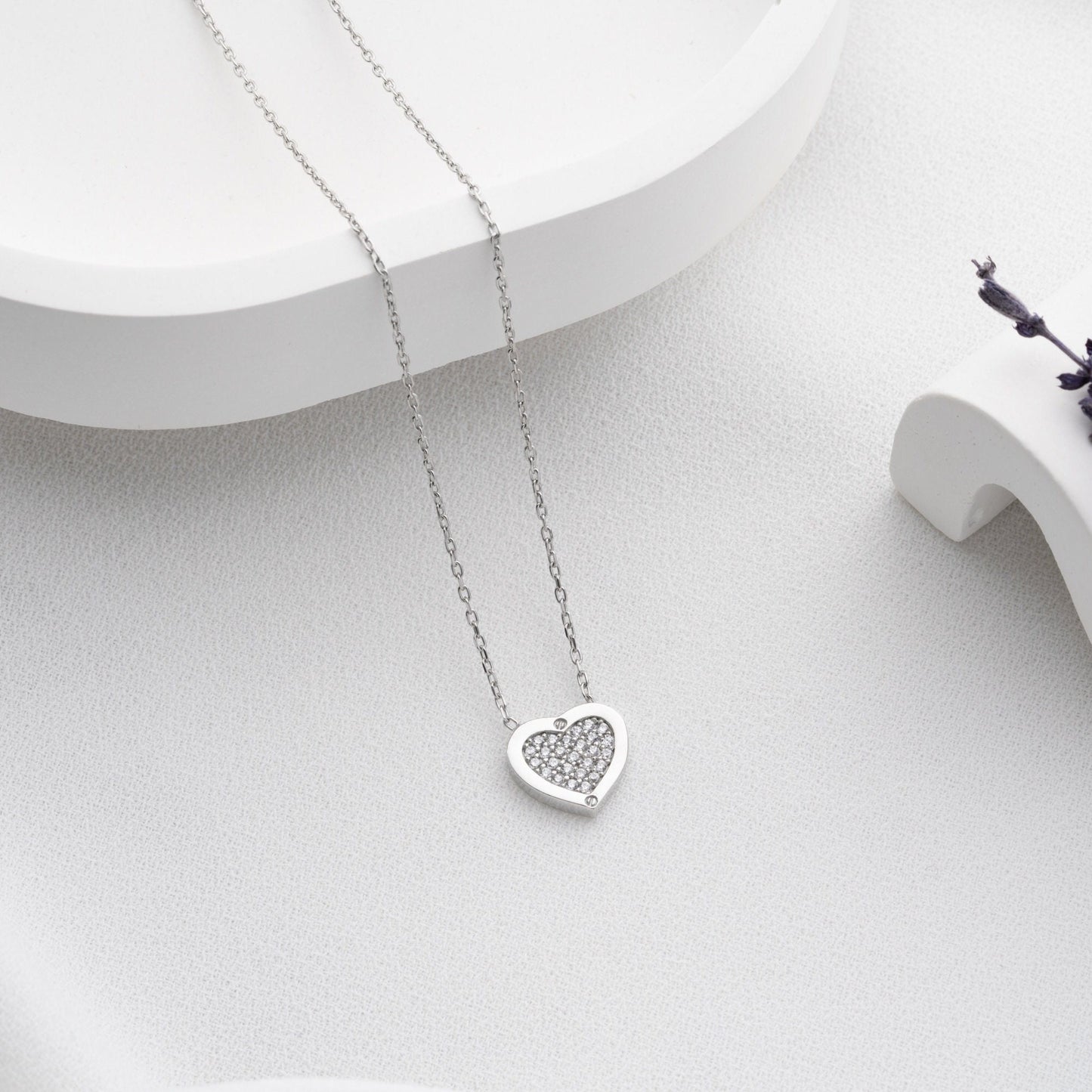 Elegant heart-shaped necklace crafted from 925 sterling silver, adorned with a central zircon stone, presented in a gift box