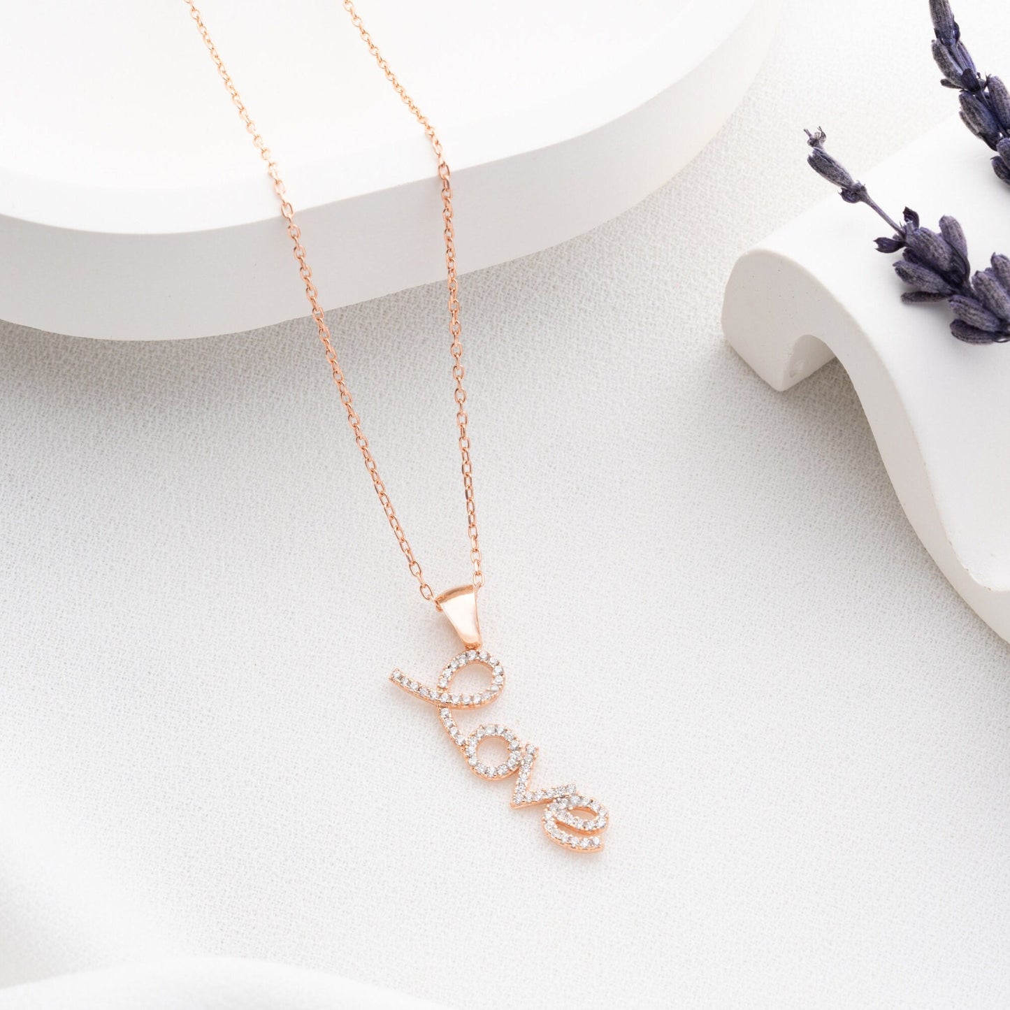 Handmade sterling silver; necklace with shimmering zircon stones delicately set along the word, reflecting elegance and romance