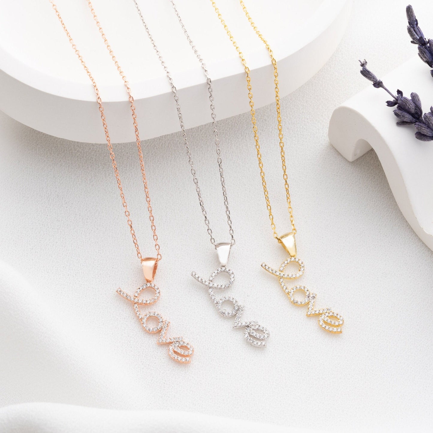 Handmade sterling silver; necklace with shimmering zircon stones delicately set along the word, reflecting elegance and romance