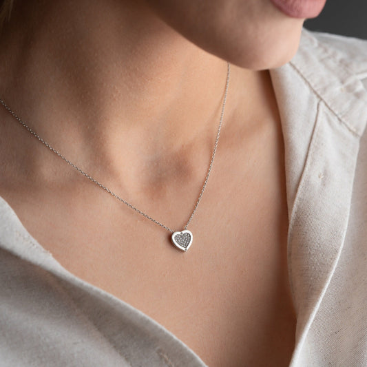 Elegant heart-shaped necklace crafted from 925 sterling silver, adorned with a central zircon stone, presented in a gift box