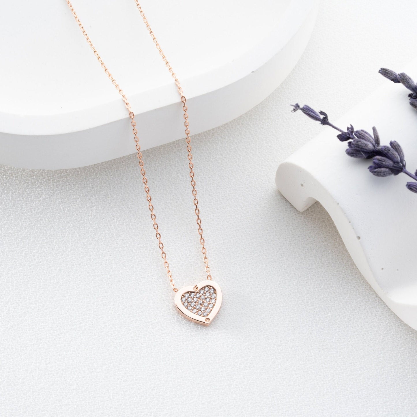 Elegant heart-shaped necklace crafted from 925 sterling silver, adorned with a central zircon stone, presented in a gift box
