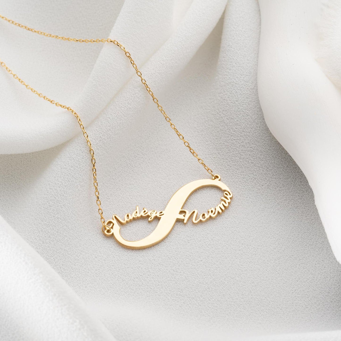 Custom infinity necklace with two personalized names, crafted in 925 sterling silver and 14k gold plated options. A timeless symbol of eternal love and unity.
