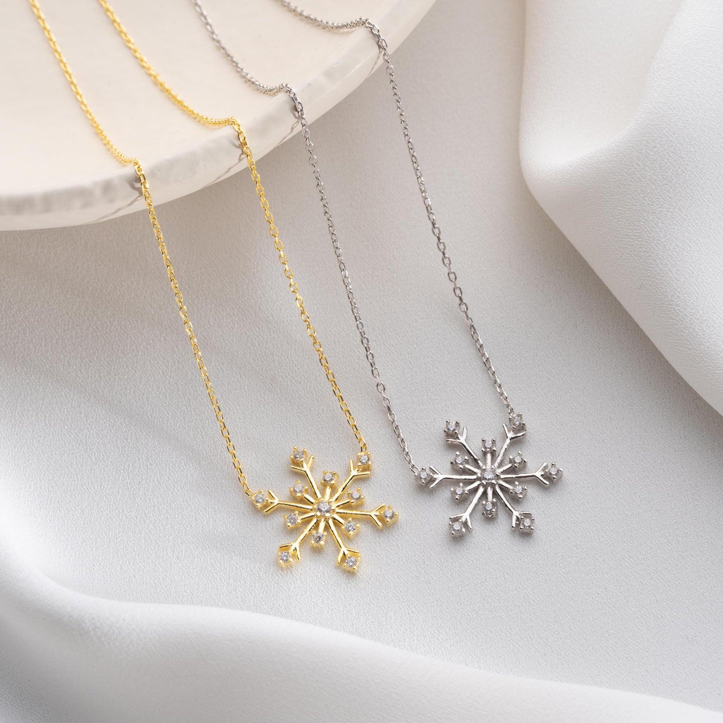 Snowflake necklace with cubic zirconia stones, perfect for Christmas, available in 925 sterling silver and 14K gold plated options.