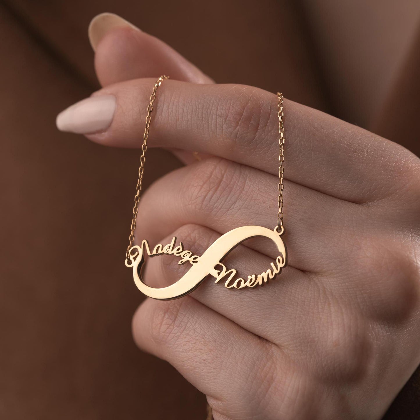Custom infinity necklace with two personalized names, crafted in 925 sterling silver and 14k gold plated options. A timeless symbol of eternal love and unity.