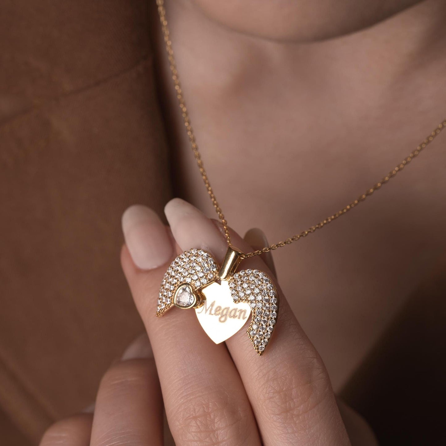 Personalized heart necklace with angel wings and name engraving, available in 925 sterling silver, 14k gold, and rose gold plated options. A meaningful, handmade jewelry gift for loved ones.