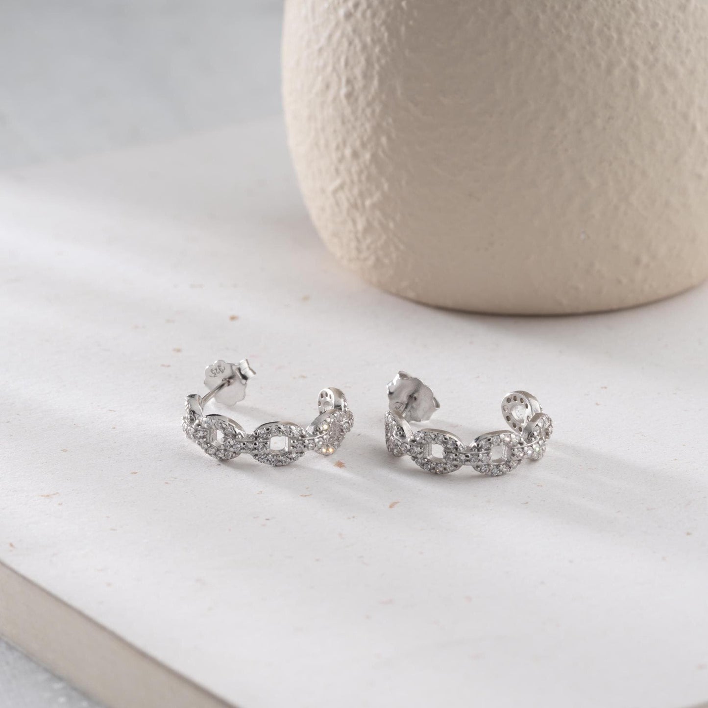 Chain link hoop earrings in 925 sterling silver with 14K gold plated option, adorned with sparkling cubic zirconia stones, ideal for gifting.
