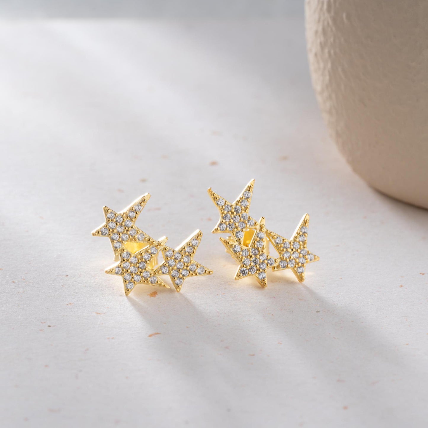 Star cluster earrings in 925 Sterling Silver and 14K Gold Plated options, adorned with cubic zirconia stones for an elegant holiday look.