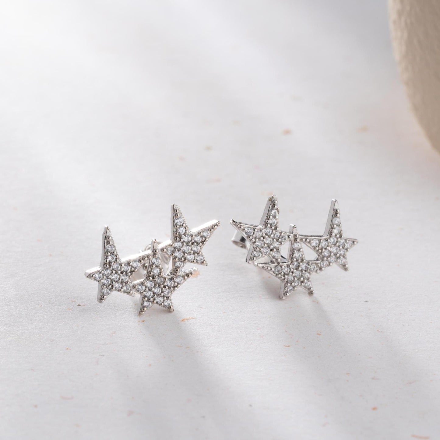 Star cluster earrings in 925 Sterling Silver and 14K Gold Plated options, adorned with cubic zirconia stones for an elegant holiday look.
