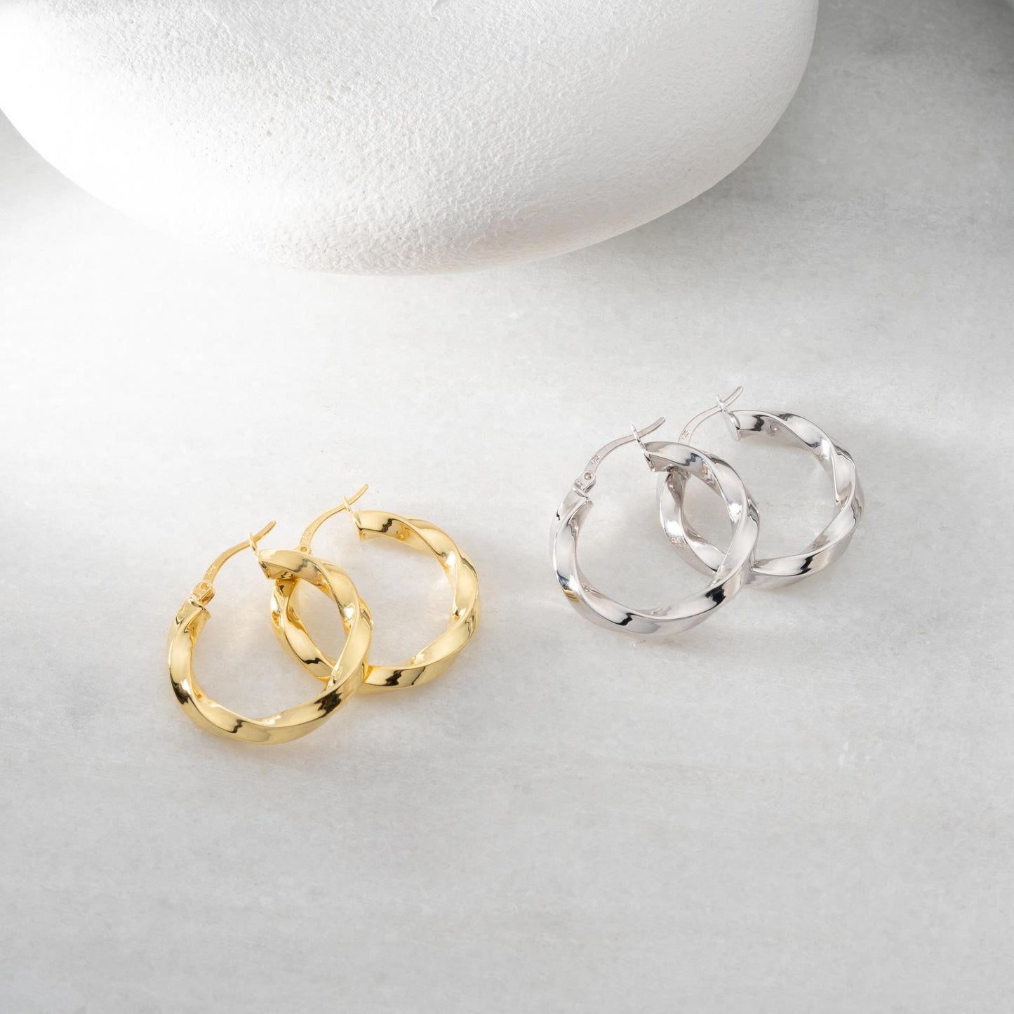 Twisted hoop earrings crafted from 925 sterling silver with a 14K gold-plated option, featuring a lever back closure, perfect for Christmas gifting and everyday wear.