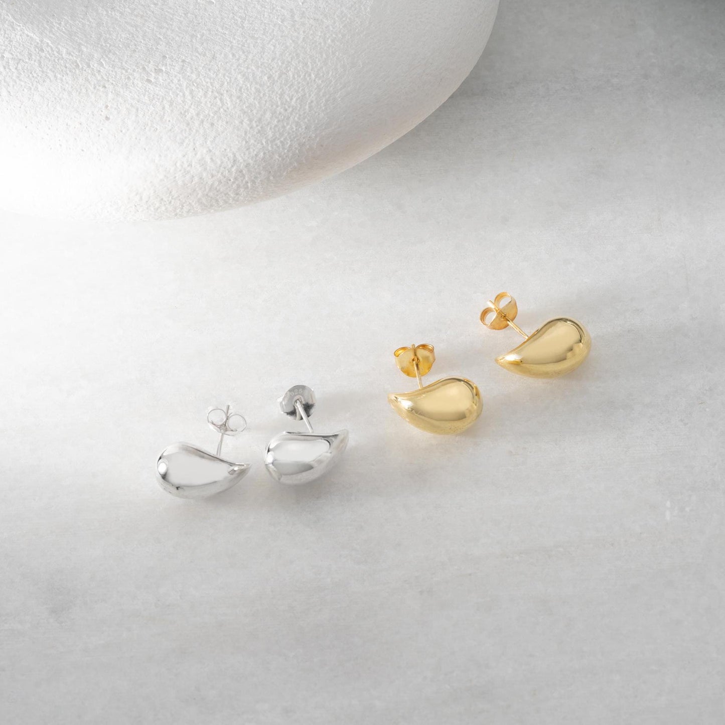 Teardrop-shaped stud earrings crafted from 925 sterling silver with a 14K gold-plated option, featuring a push back closure, perfect for Christmas gifting and everyday wear.