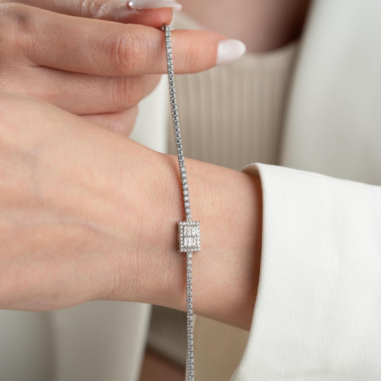 Elegant baget bracelet with cubic zirconia stones, made of 925 sterling silver, available in silver and gold finishes.