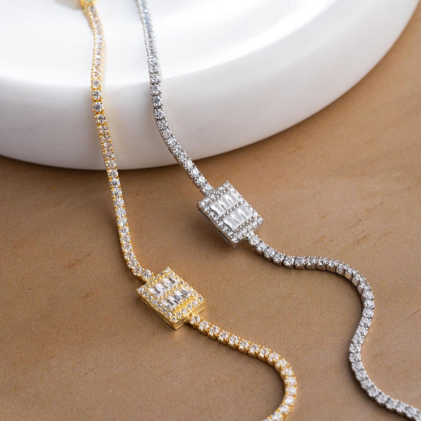 Elegant baget bracelet with cubic zirconia stones, made of 925 sterling silver, available in silver and gold finishes.