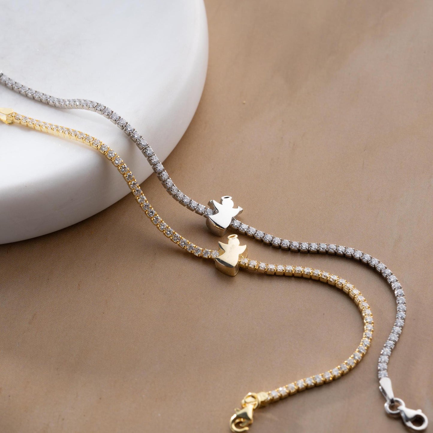 Angel Charm Bracelet in 925 Sterling Silver with a 14K Gold Plated angel charm and cubic zirconia stones, elegantly displayed.
