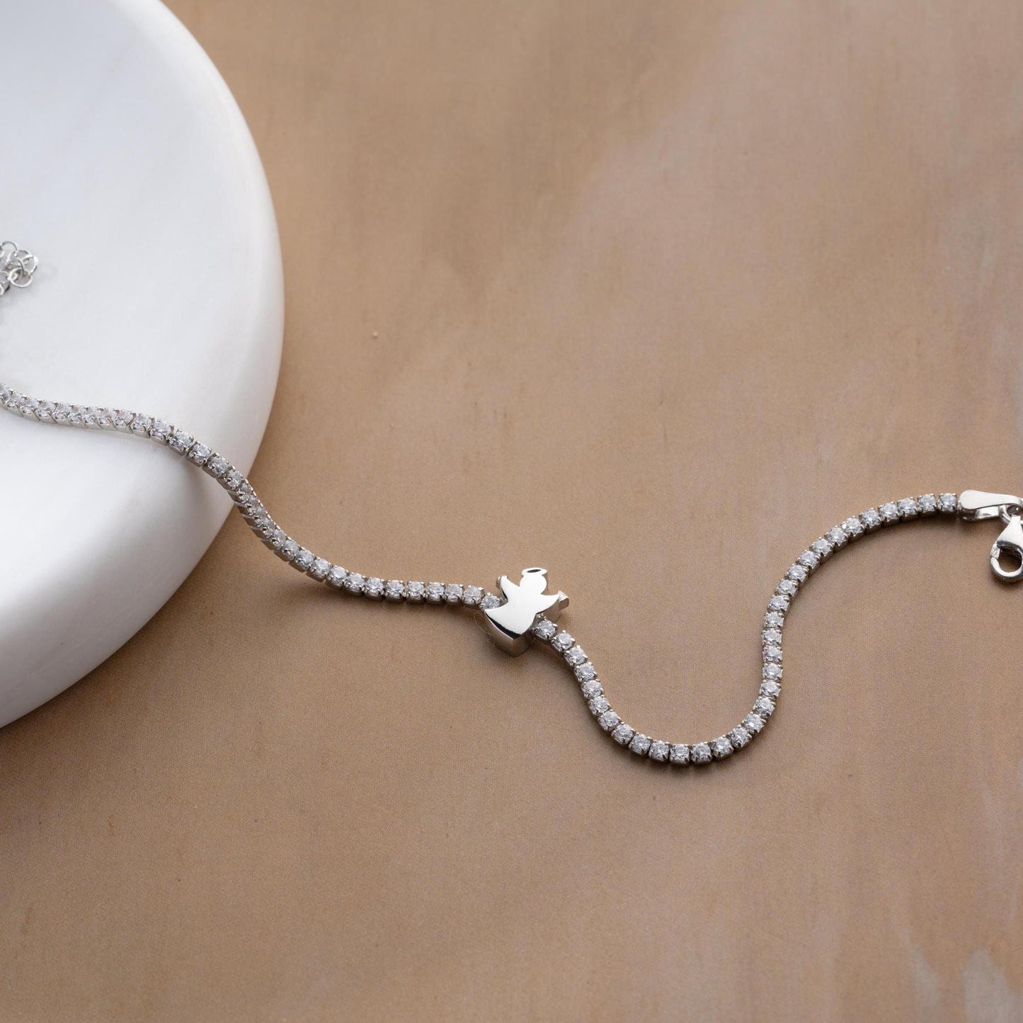 Angel Charm Bracelet in 925 Sterling Silver with a 14K Gold Plated angel charm and cubic zirconia stones, elegantly displayed.