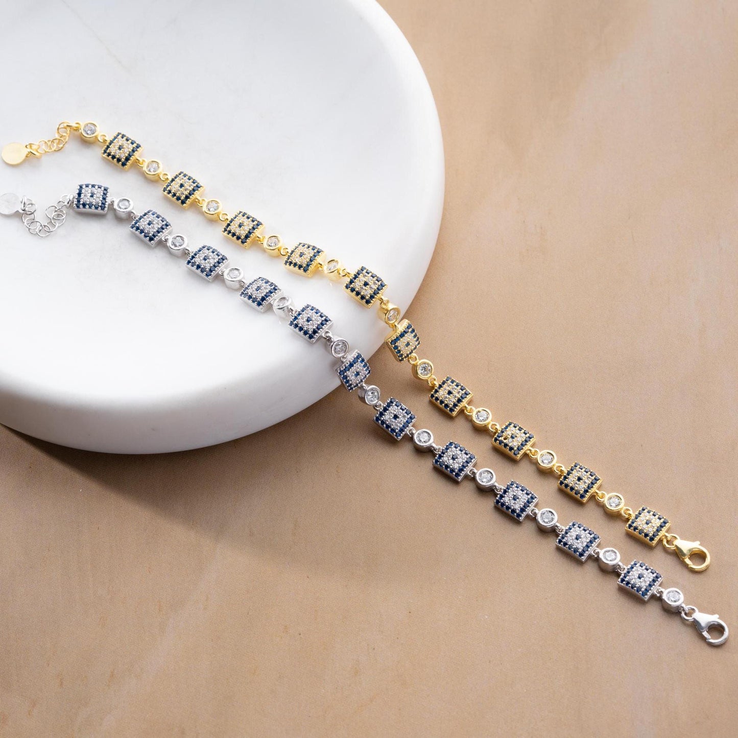 Square motif charm bracelet in 925 Sterling Silver with cubic zirconia stones, available in silver and gold finishes, perfect for Christmas gifts.