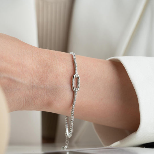 Elegant link chain tennis bracelet with cubic zirconia stones, crafted in 925 Sterling Silver and available in silver and gold finishes, perfect for festive gifting.
