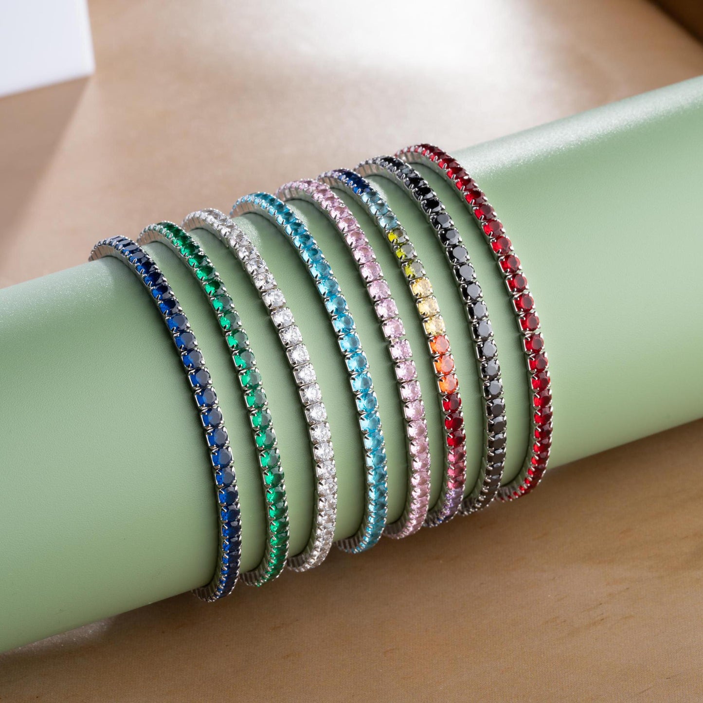 Vibrant stackable tennis bracelet set featuring multicolored cubic zirconia stones, crafted in 925 Sterling Silver with a 14K Gold Plated option, perfect for festive and everyday wear.