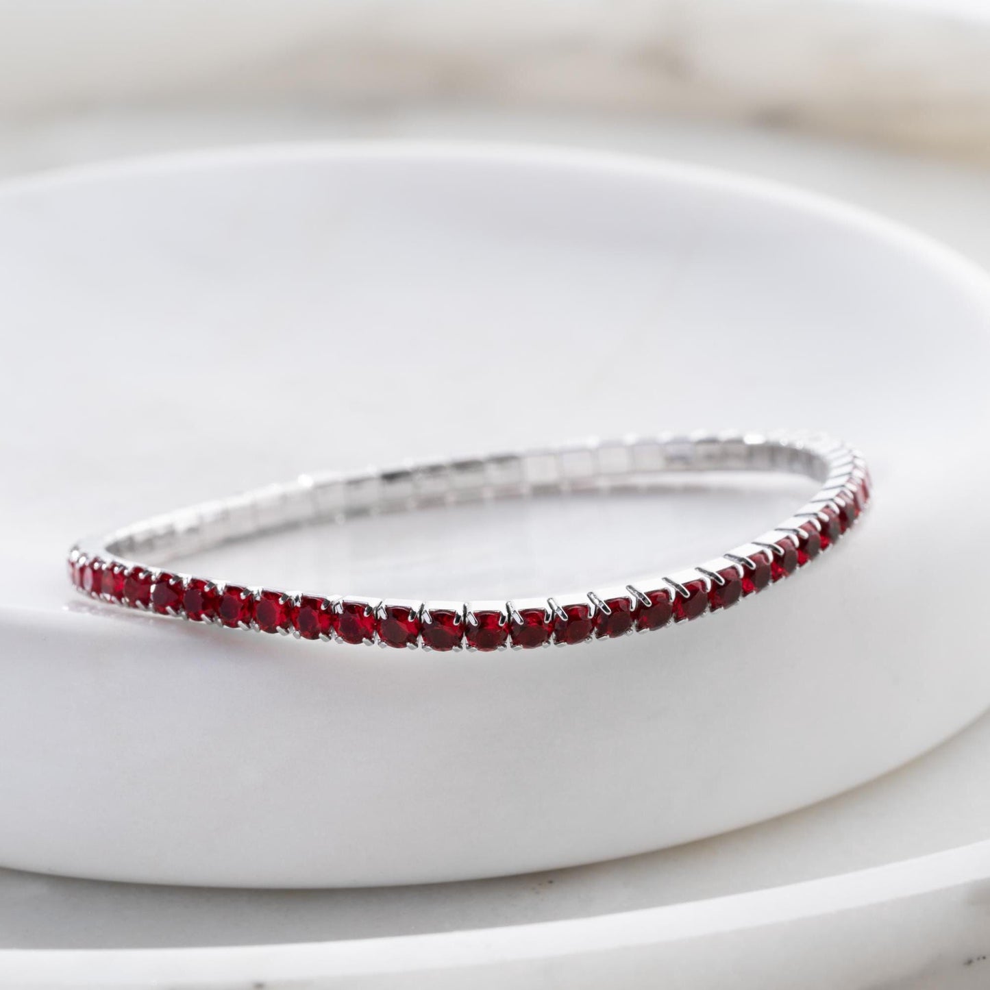 Vibrant stackable tennis bracelet set featuring multicolored cubic zirconia stones, crafted in 925 Sterling Silver with a 14K Gold Plated option, perfect for festive and everyday wear.
