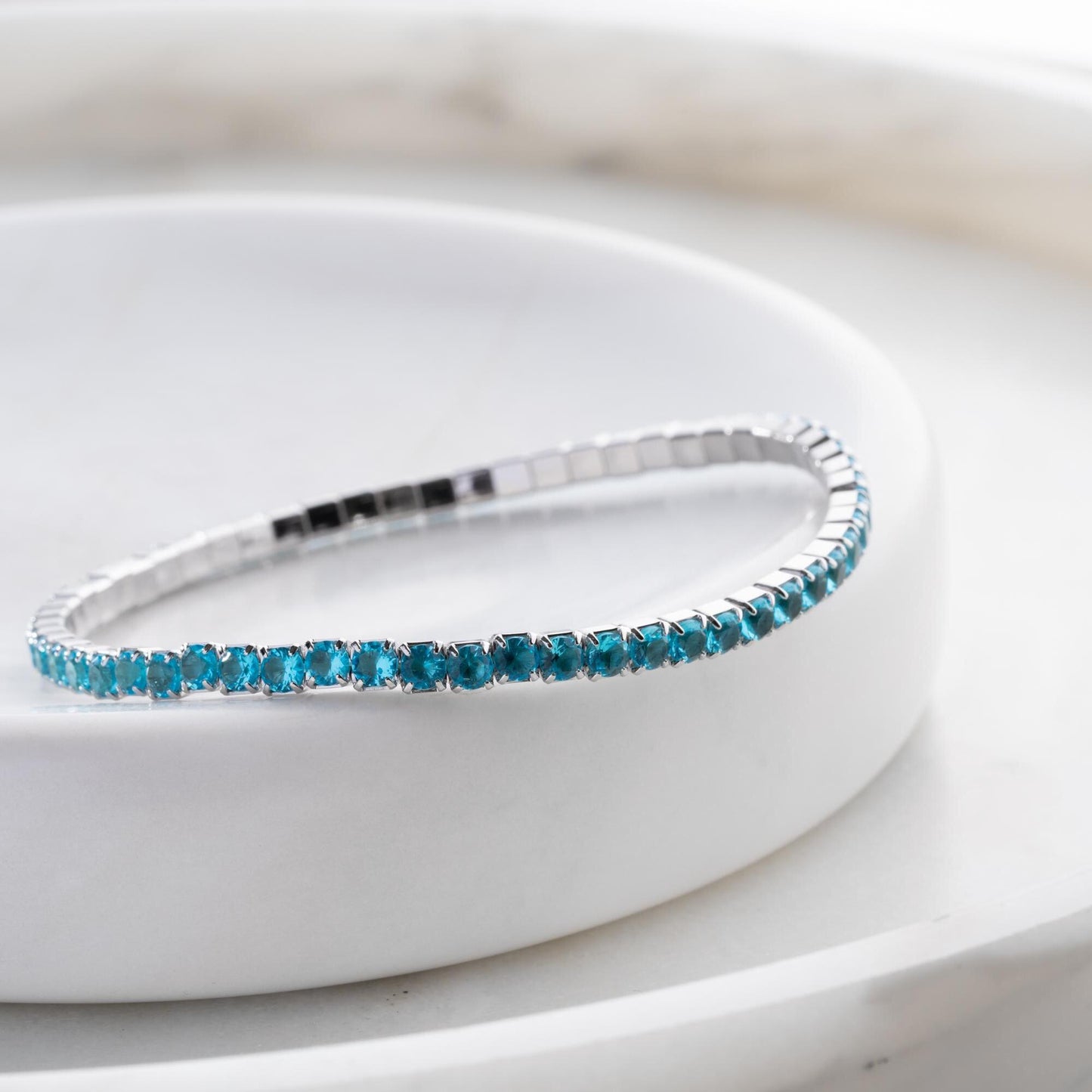 Vibrant stackable tennis bracelet set featuring multicolored cubic zirconia stones, crafted in 925 Sterling Silver with a 14K Gold Plated option, perfect for festive and everyday wear.