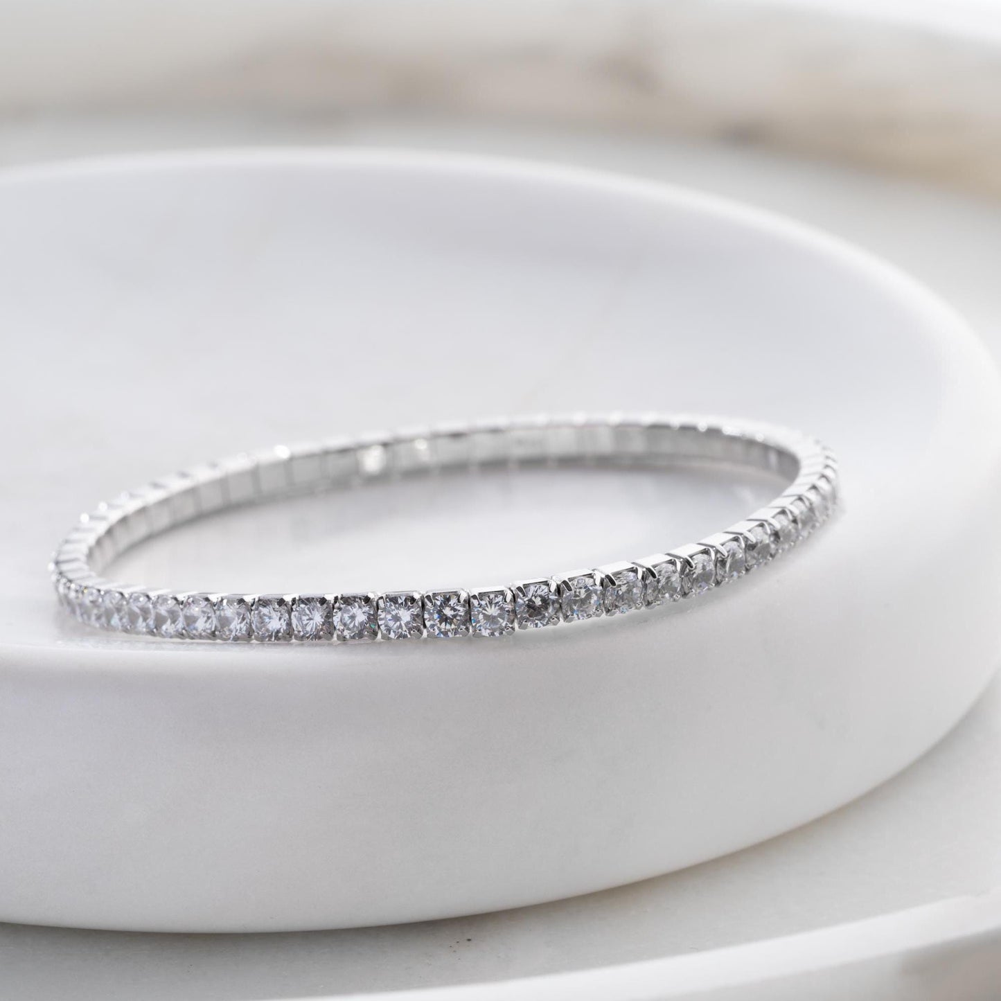 Vibrant stackable tennis bracelet set featuring multicolored cubic zirconia stones, crafted in 925 Sterling Silver with a 14K Gold Plated option, perfect for festive and everyday wear.