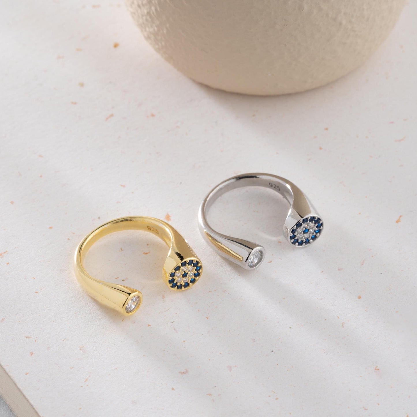 Adjustable open ring featuring a round evil eye charm with cubic zirconia stones, crafted in 925 Sterling Silver and 14K Gold Plated finish.