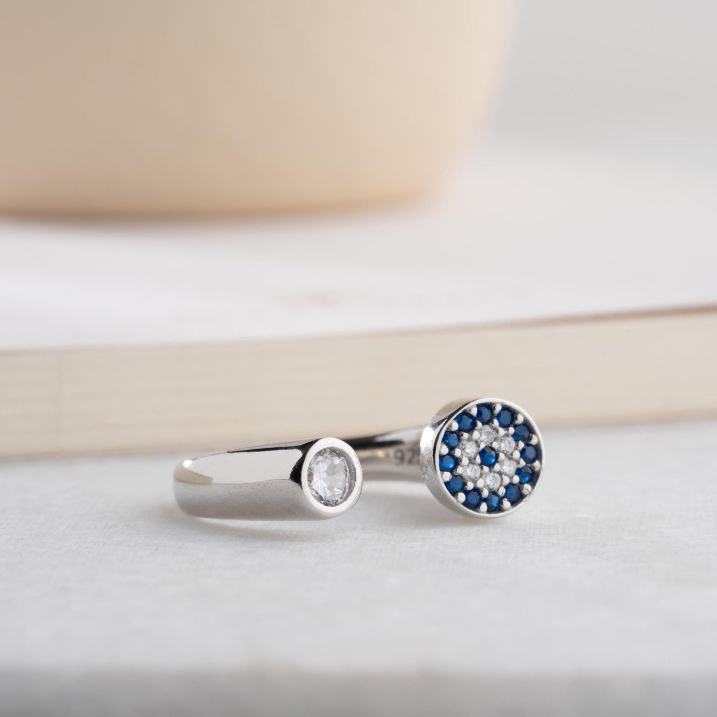 Adjustable open ring featuring a round evil eye charm with cubic zirconia stones, crafted in 925 Sterling Silver and 14K Gold Plated finish.