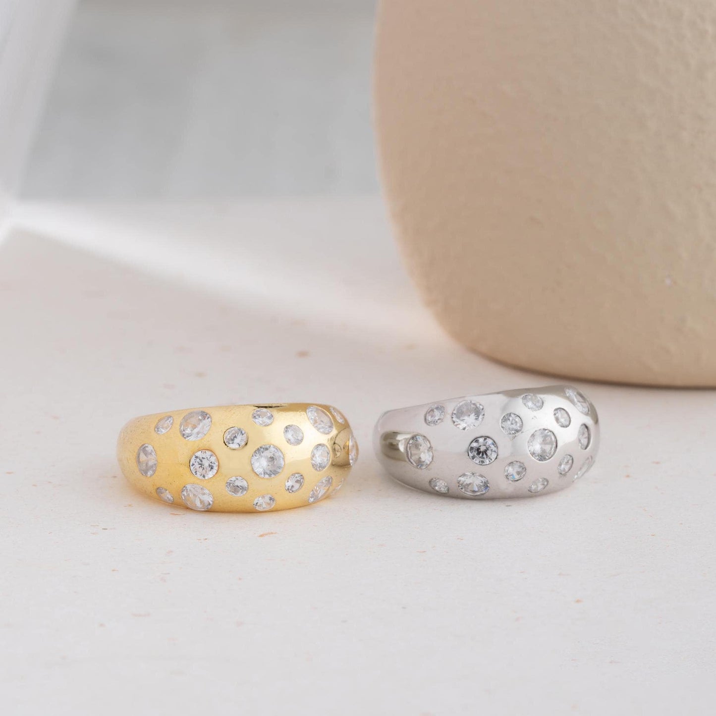 Elegant pave dome ring featuring dazzling cubic zirconia stones, crafted in 925 sterling silver with 14K gold plated options. A luxurious, adjustable statement ring for women.