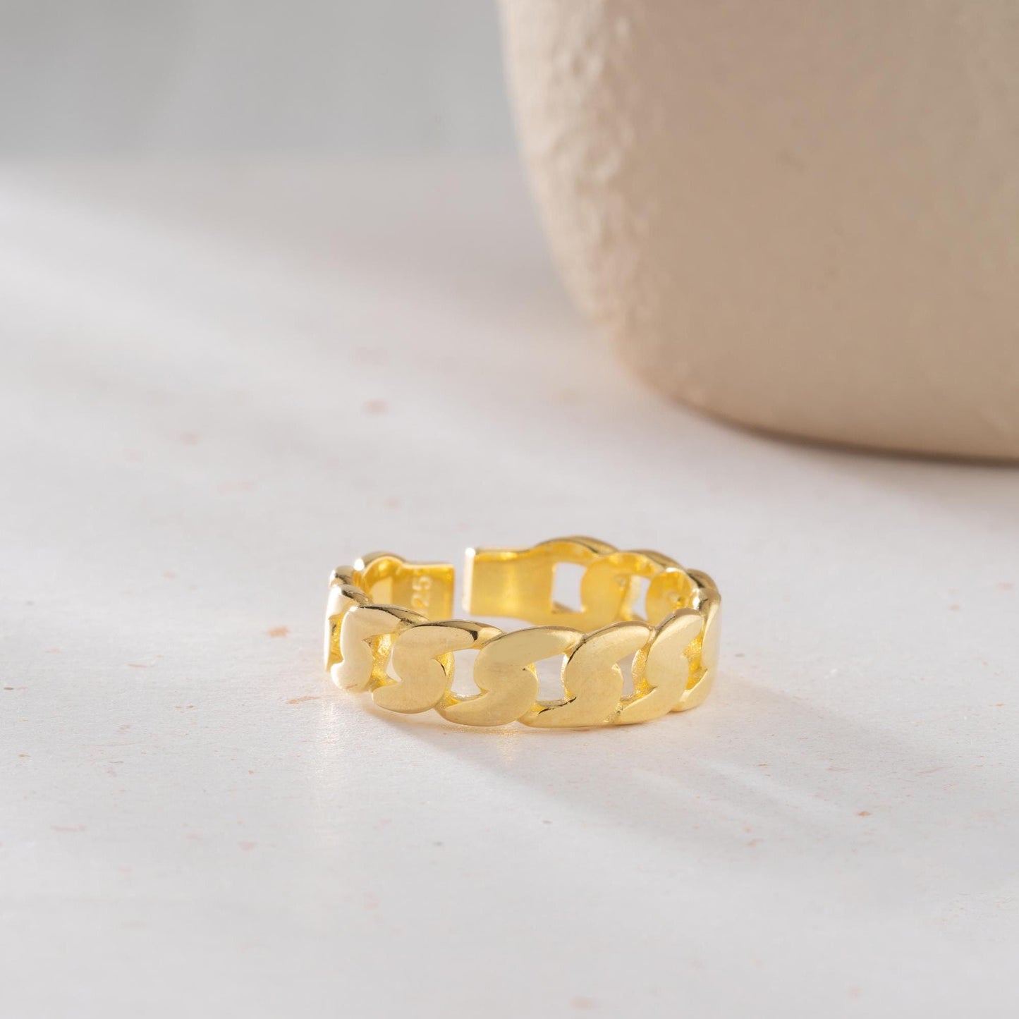 Chunky chain link ring crafted from 925 sterling silver with 14K gold plating, featuring an adjustable open band. Stylish unisex jewelry perfect for bold statement looks.