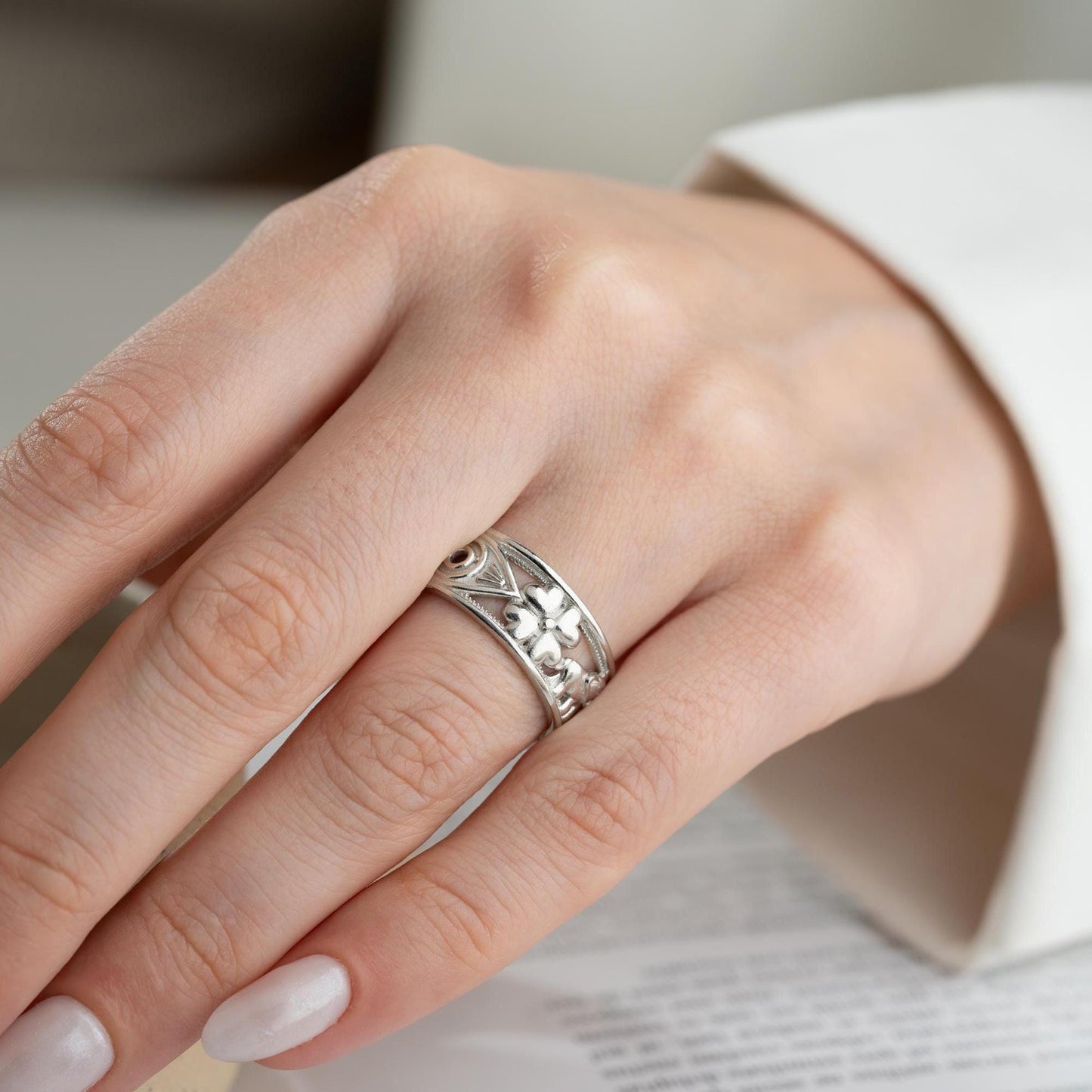 Floral wide band ring with intricate openwork flower design, available in 925 sterling silver and 14K gold plating. Elegant nature-inspired jewelry perfect for gifting.