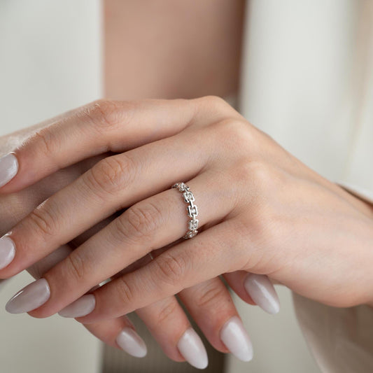 A dazzling chain link eternity ring with cubic zirconia stones, handcrafted from 925 sterling silver and available in silver or 14K gold plated finishes. Ideal for birthdays, anniversaries, and gifts for her.