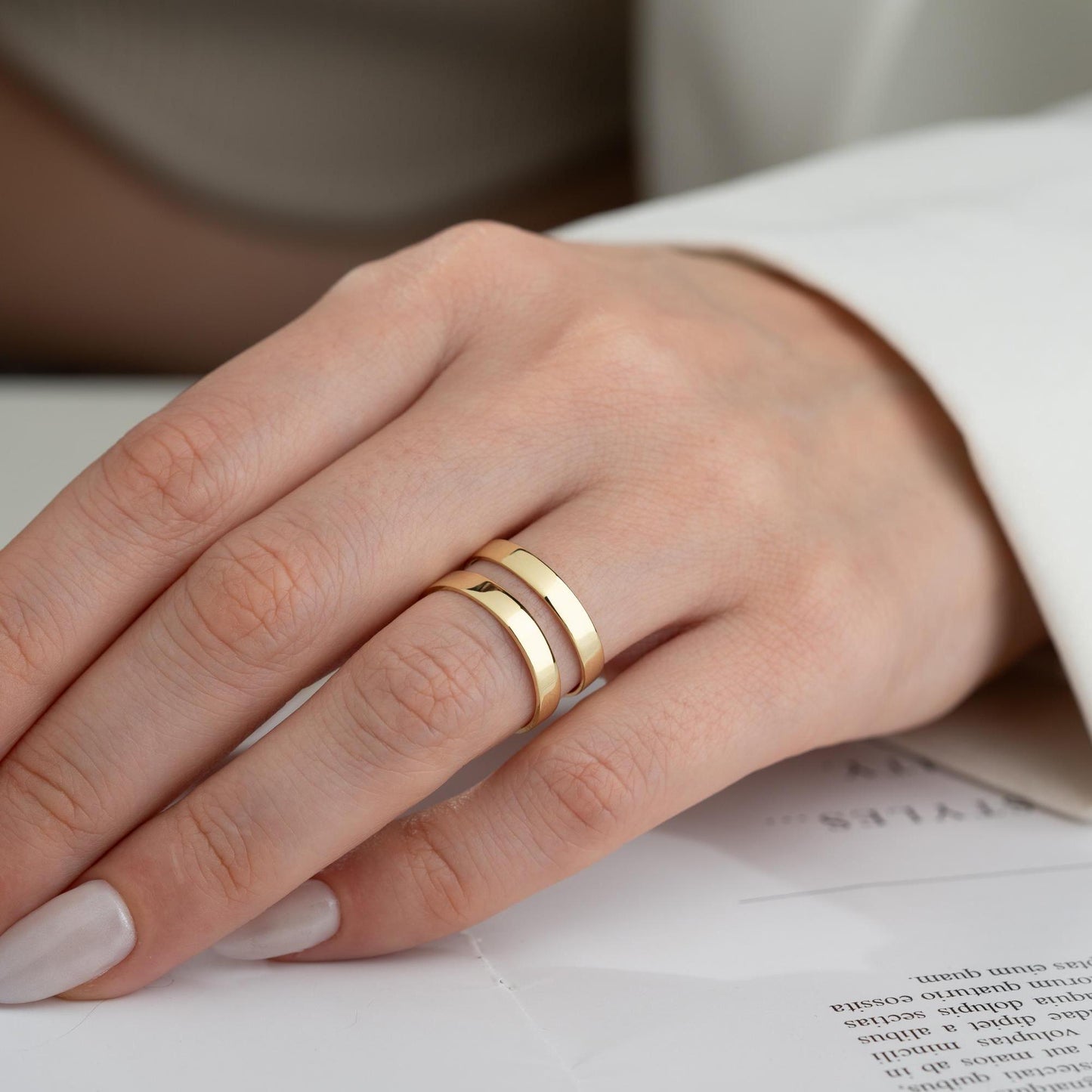 A sleek minimalist double-band ring, handcrafted from 925 sterling silver with 14K gold and rose gold plated options. A perfect stackable jewelry piece for everyday wear or as a gift for her.