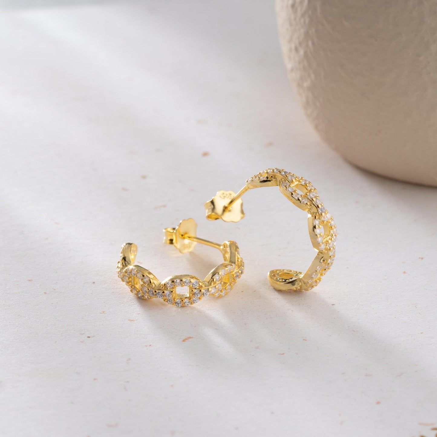 Chain link hoop earrings in 925 sterling silver with 14K gold plated option, adorned with sparkling cubic zirconia stones, ideal for gifting.