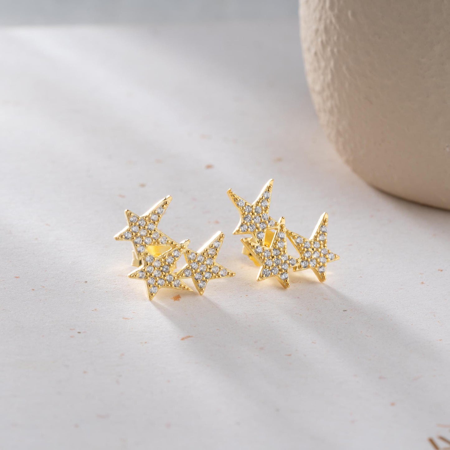 Star cluster earrings in 925 Sterling Silver and 14K Gold Plated options, adorned with cubic zirconia stones for an elegant holiday look.