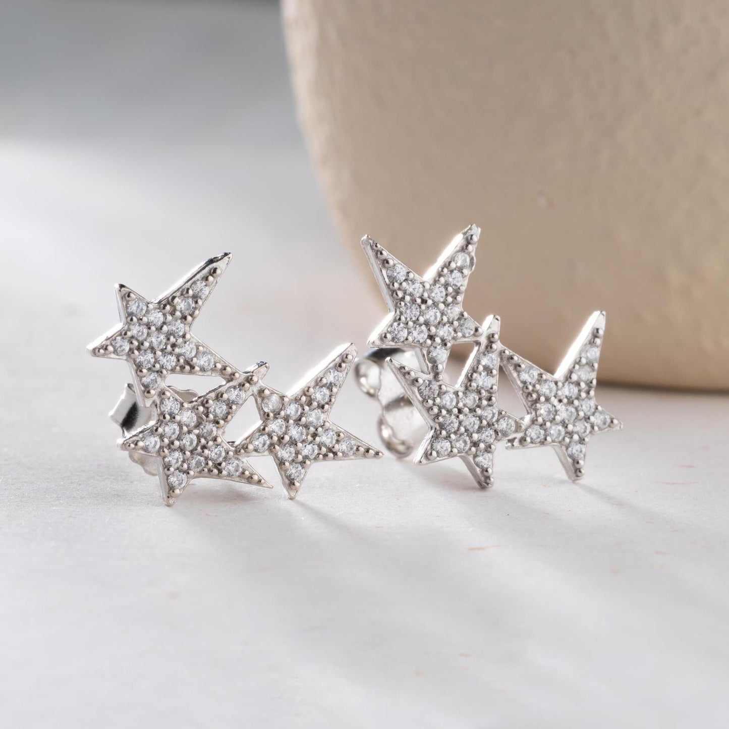 Star cluster earrings in 925 Sterling Silver and 14K Gold Plated options, adorned with cubic zirconia stones for an elegant holiday look.