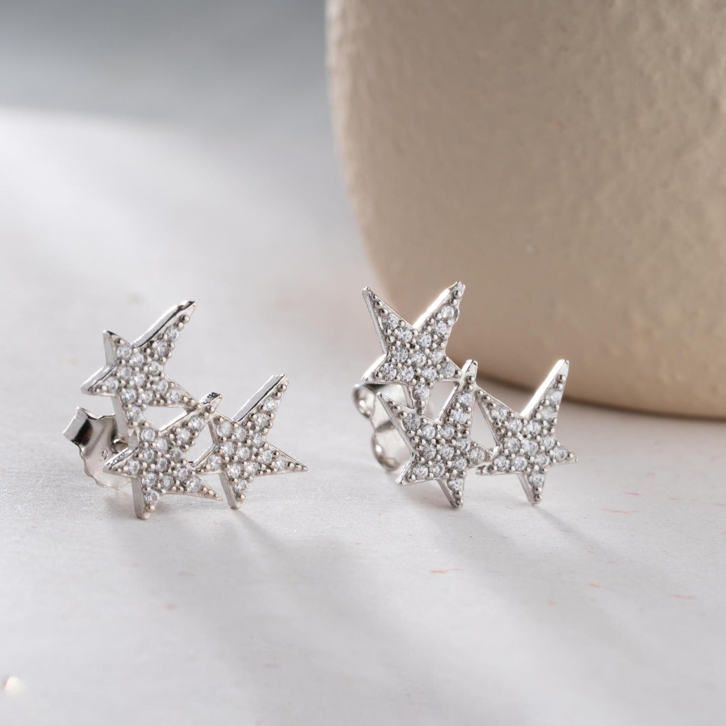 Star cluster earrings in 925 Sterling Silver and 14K Gold Plated options, adorned with cubic zirconia stones for an elegant holiday look.