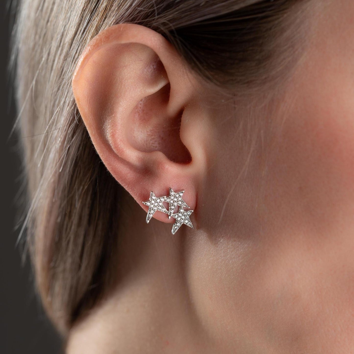 Star cluster earrings in 925 Sterling Silver and 14K Gold Plated options, adorned with cubic zirconia stones for an elegant holiday look.