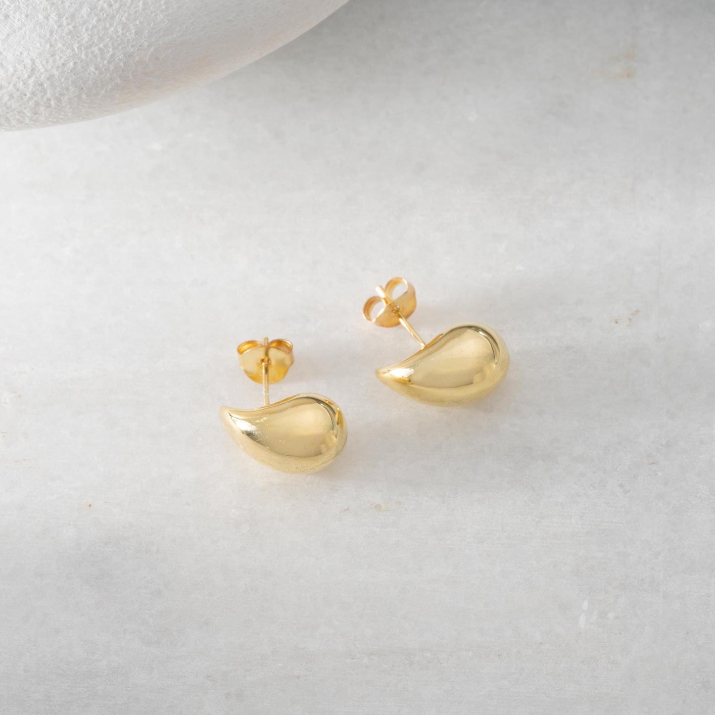 Teardrop-shaped stud earrings crafted from 925 sterling silver with a 14K gold-plated option, featuring a push back closure, perfect for Christmas gifting and everyday wear.