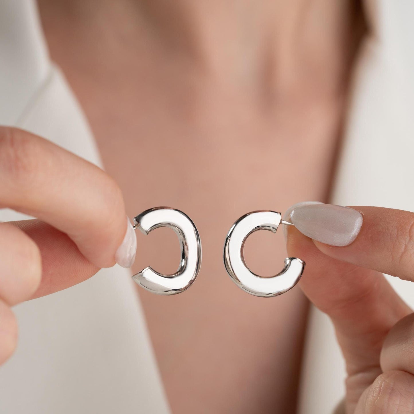 Chunky hoop earrings crafted from 925 sterling silver with a 14K gold-plated option, perfect for a minimalist yet bold look.