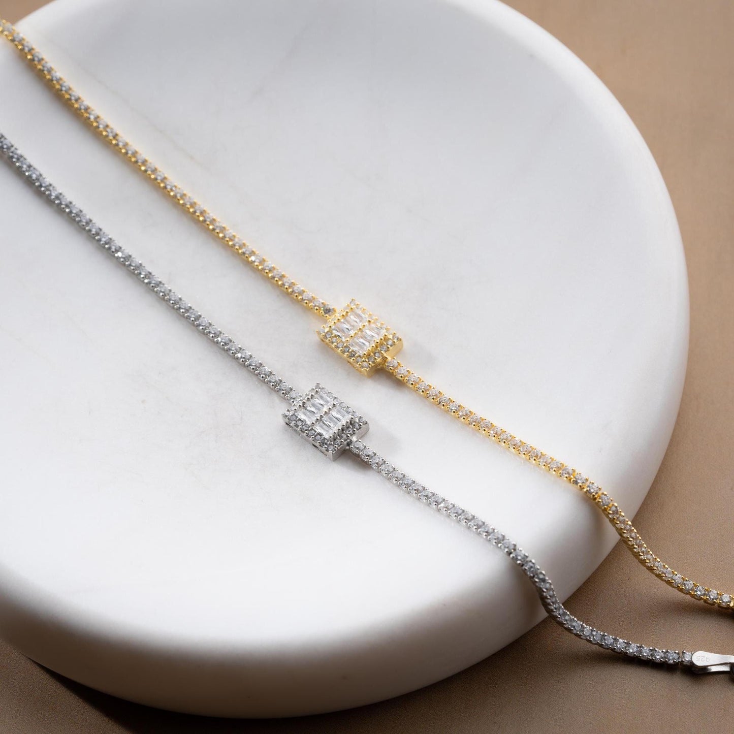 Elegant baget bracelet with cubic zirconia stones, made of 925 sterling silver, available in silver and gold finishes.