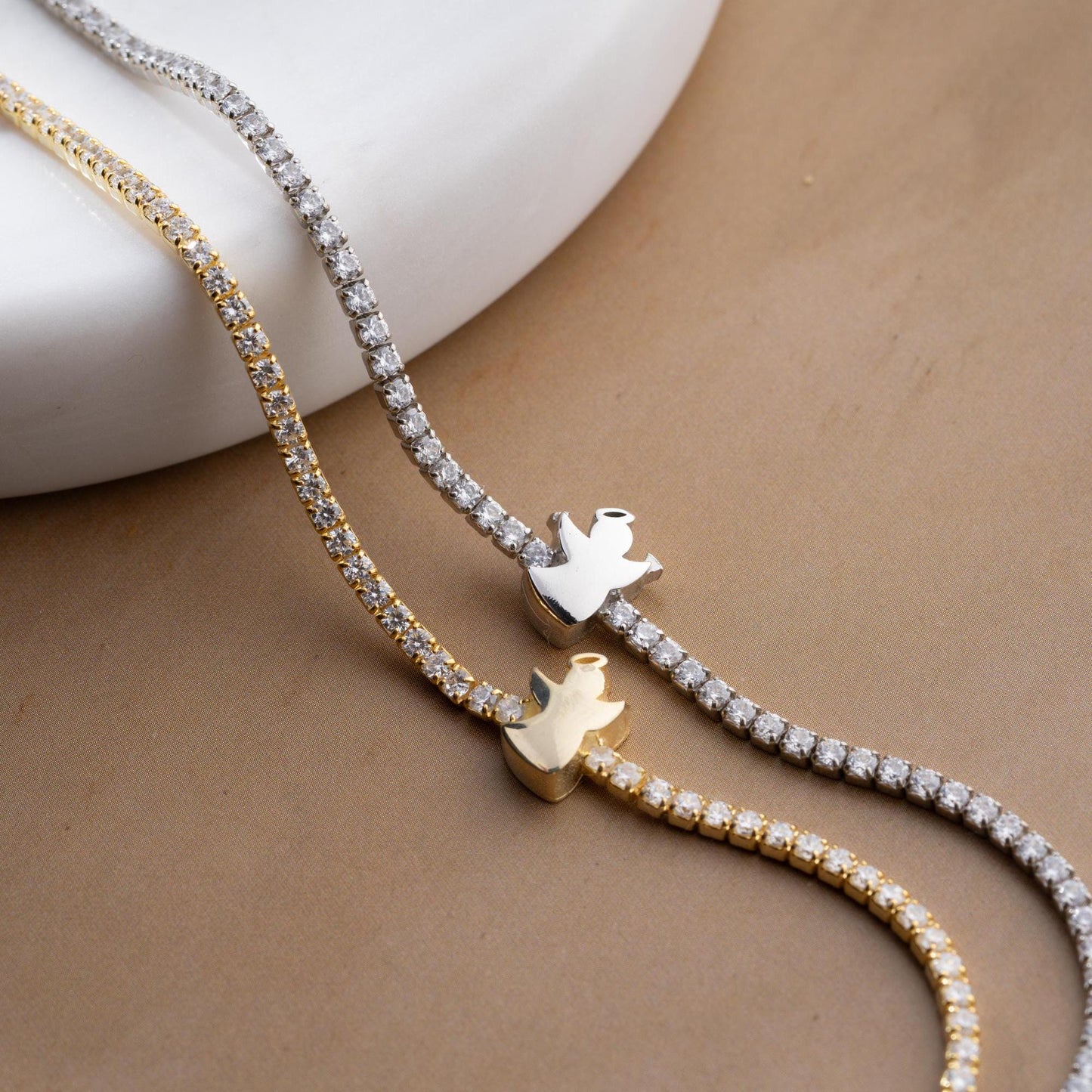 Angel Charm Bracelet in 925 Sterling Silver with a 14K Gold Plated angel charm and cubic zirconia stones, elegantly displayed.