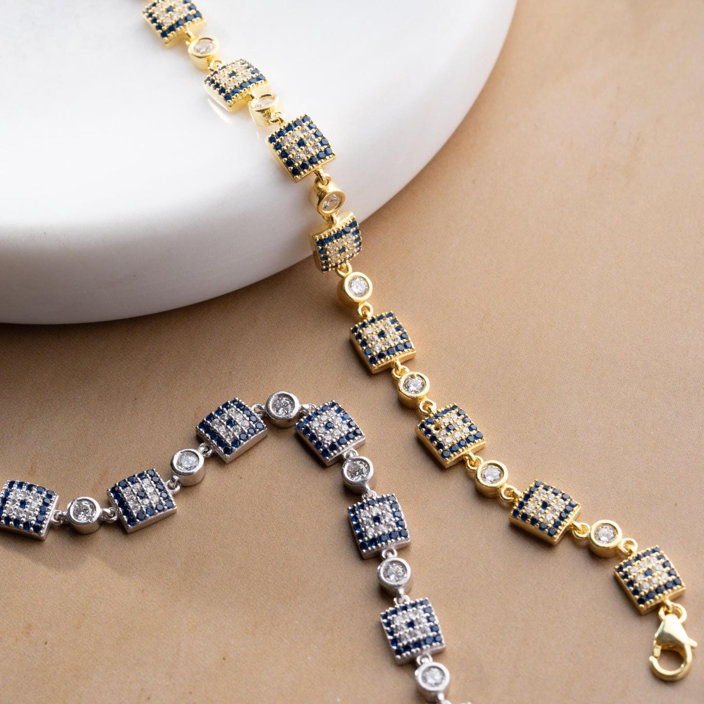 Square motif charm bracelet in 925 Sterling Silver with cubic zirconia stones, available in silver and gold finishes, perfect for Christmas gifts.