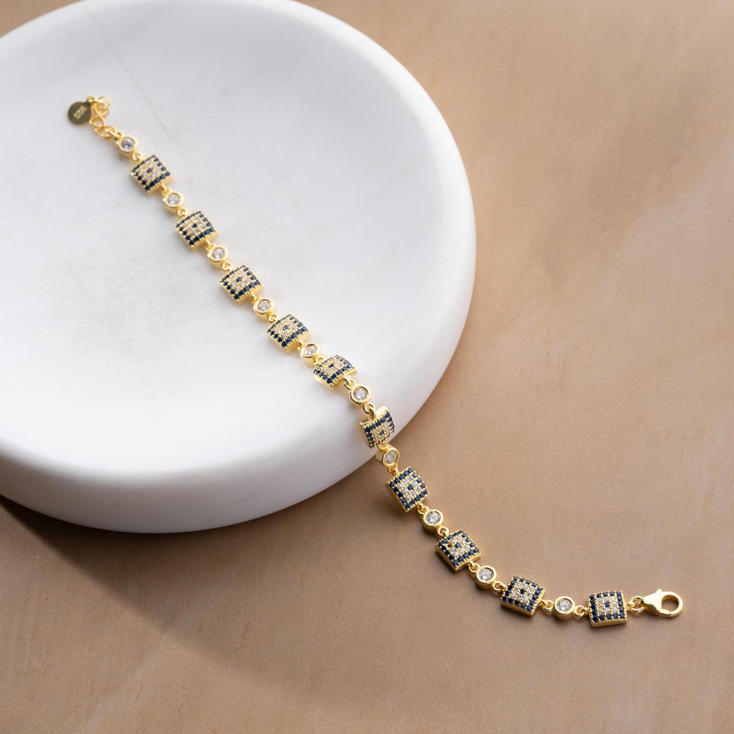 Square motif charm bracelet in 925 Sterling Silver with cubic zirconia stones, available in silver and gold finishes, perfect for Christmas gifts.