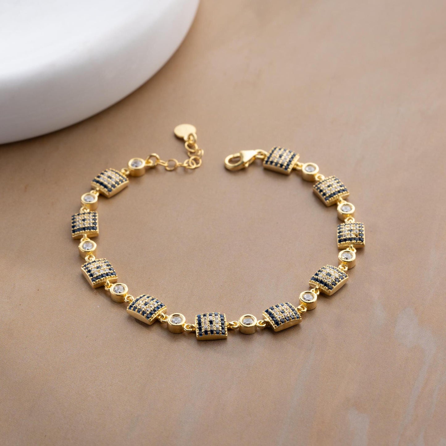 Square motif charm bracelet in 925 Sterling Silver with cubic zirconia stones, available in silver and gold finishes, perfect for Christmas gifts.