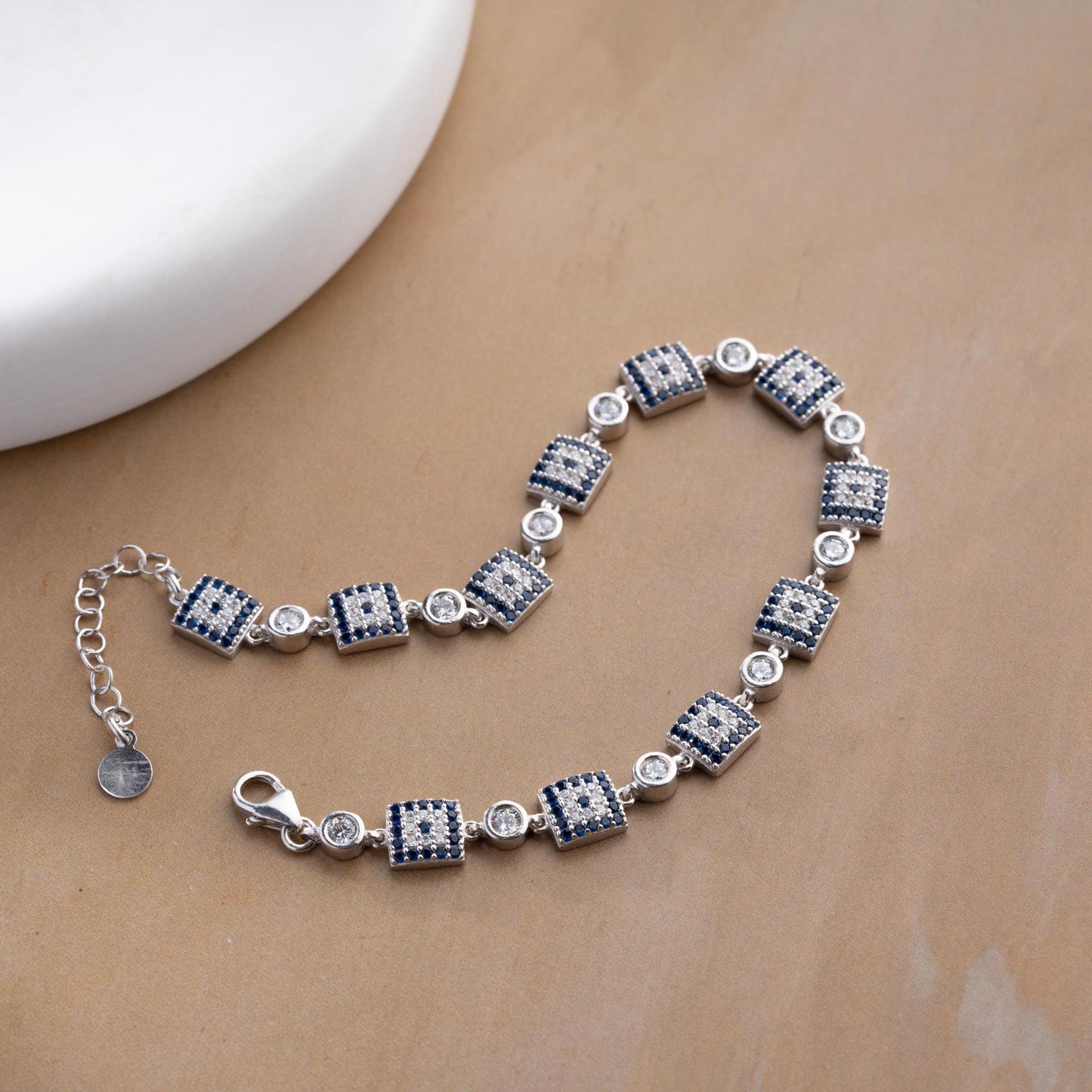 Square motif charm bracelet in 925 Sterling Silver with cubic zirconia stones, available in silver and gold finishes, perfect for Christmas gifts.