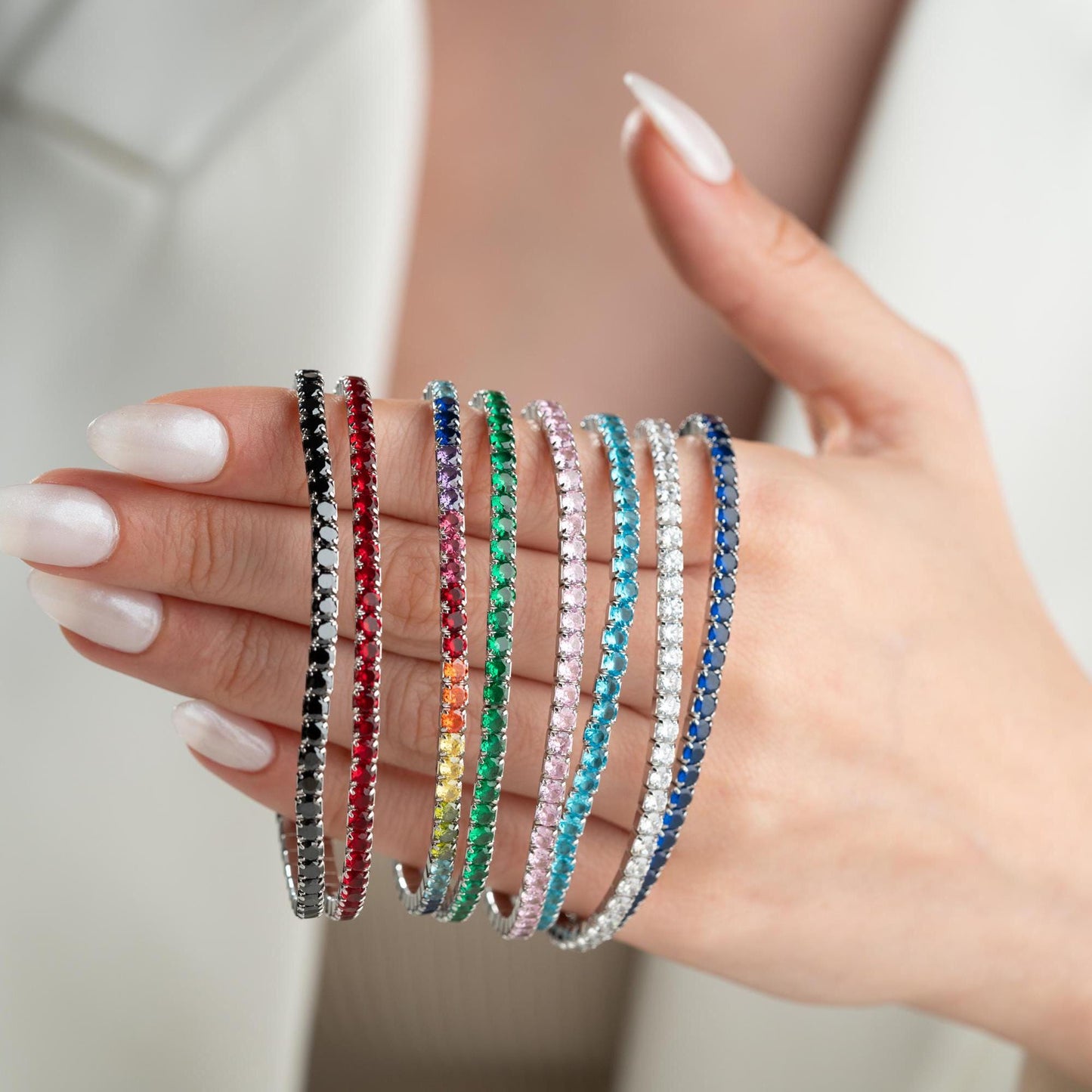 Vibrant stackable tennis bracelet set featuring multicolored cubic zirconia stones, crafted in 925 Sterling Silver with a 14K Gold Plated option, perfect for festive and everyday wear.