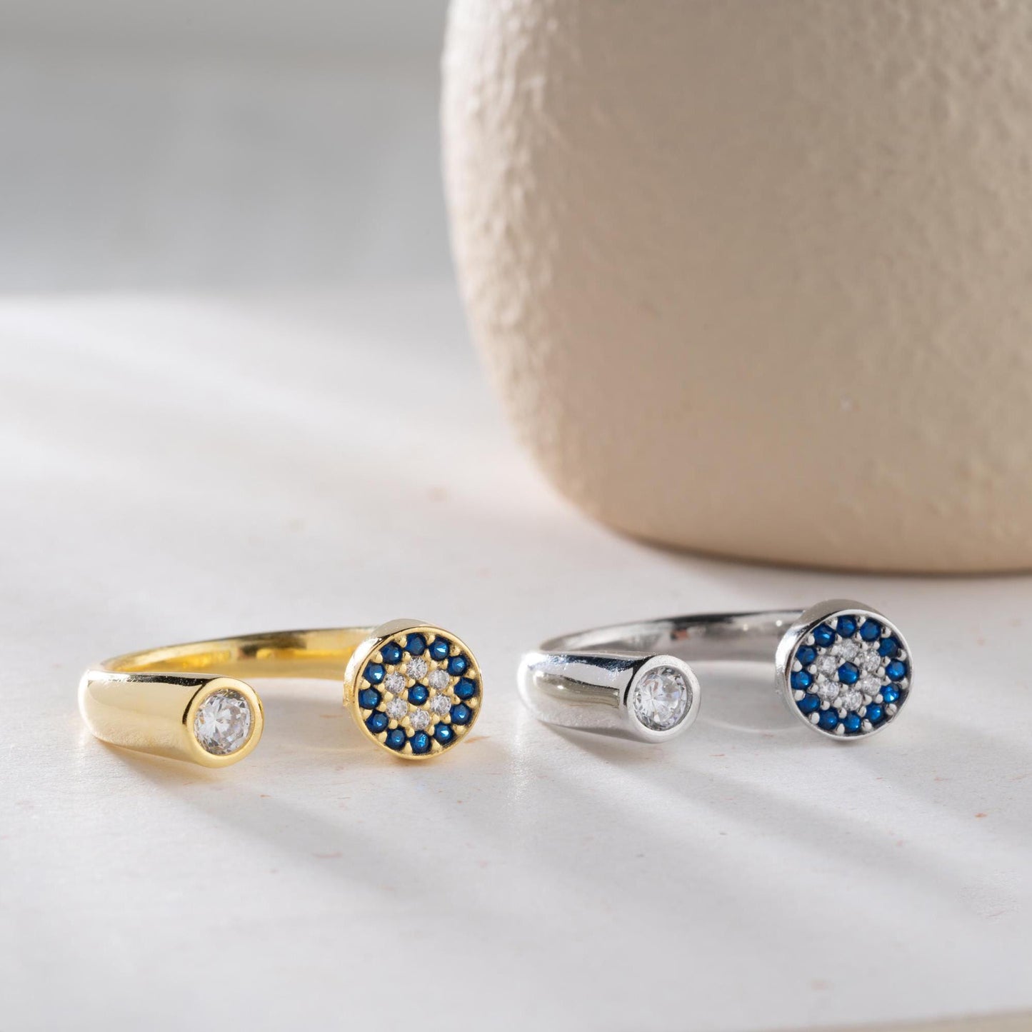 Adjustable open ring featuring a round evil eye charm with cubic zirconia stones, crafted in 925 Sterling Silver and 14K Gold Plated finish.
