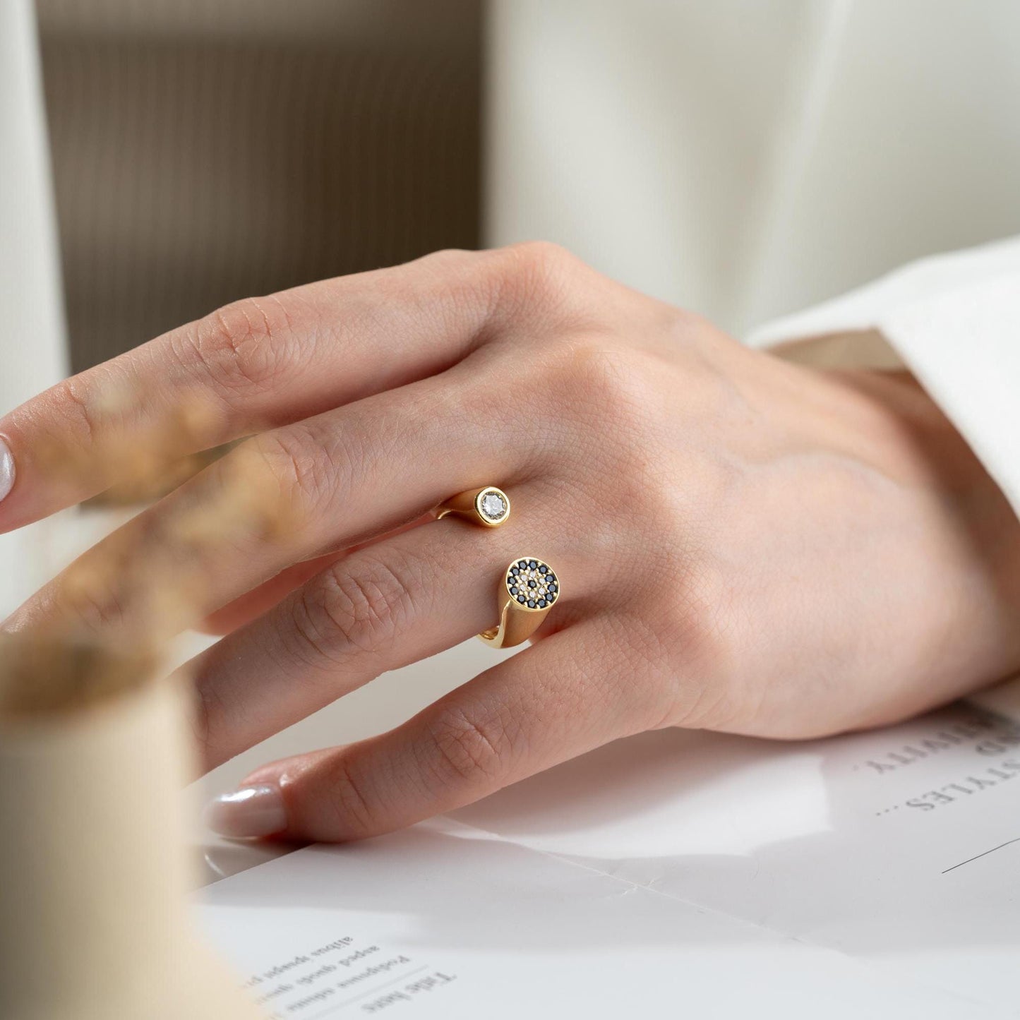 Adjustable open ring featuring a round evil eye charm with cubic zirconia stones, crafted in 925 Sterling Silver and 14K Gold Plated finish.