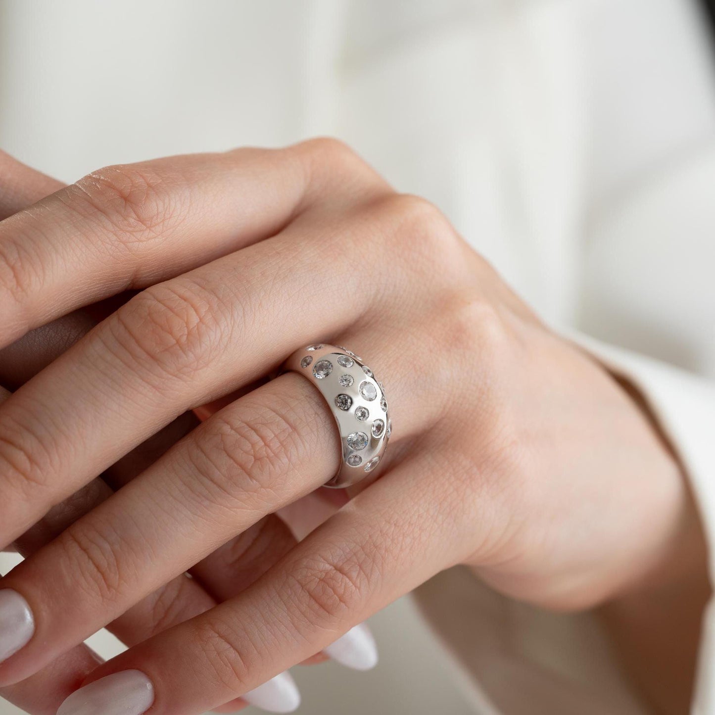 Elegant pave dome ring featuring dazzling cubic zirconia stones, crafted in 925 sterling silver with 14K gold plated options. A luxurious, adjustable statement ring for women.