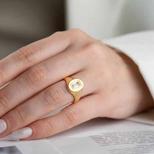 Baguette signet ring featuring a sleek baguette-cut cubic zirconia stone, crafted from 925 Sterling Silver with gold plating option, elegant for daily wear or gifting.