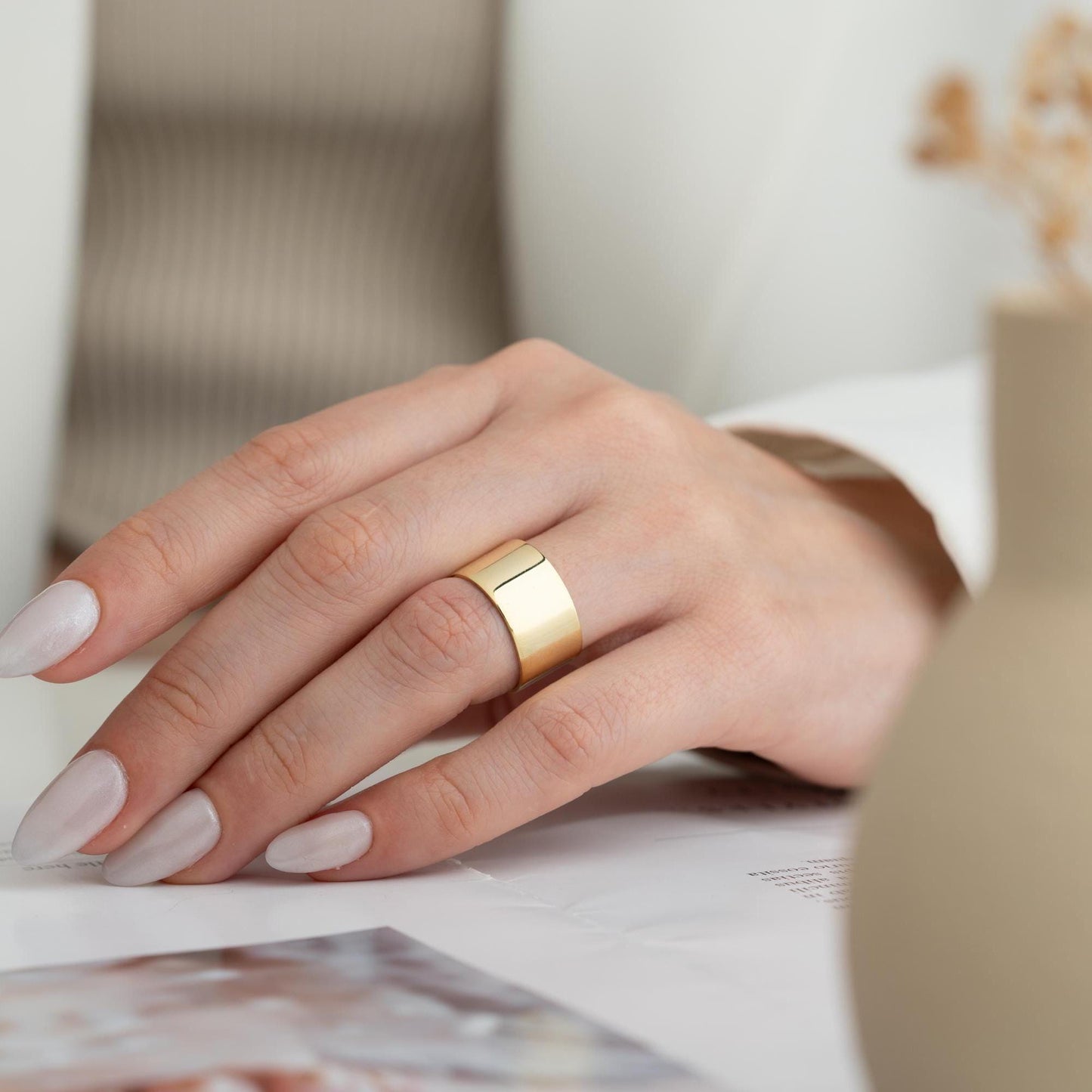 A bold, wide band open ring crafted from 925 Sterling Silver, available in gold and rose gold finishes. Adjustable design for comfort and style, ideal for gifting.